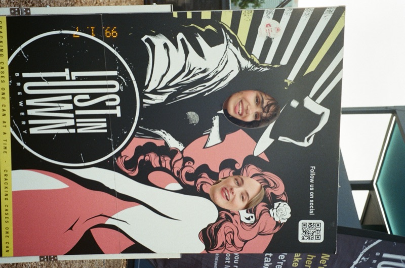 Fans posing with Lost in Town character cutout board at London Craft Beer Festival